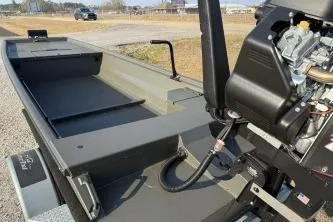 Slide: The Image of 2026 Gator Tail 1748 Gator Series boat with motor, parked on gravel road. - 7