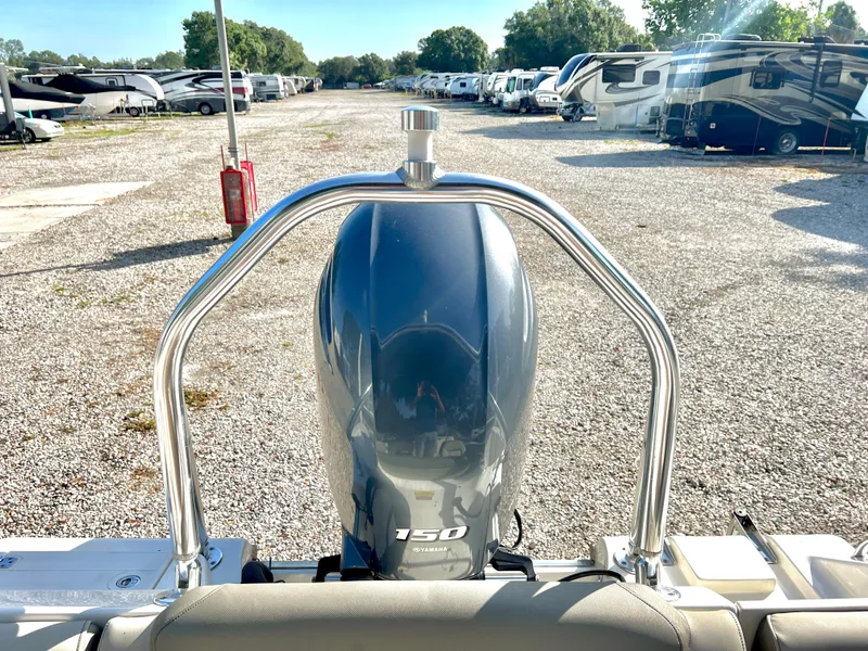 Slide: The Image of Key West 203 DFS 2021 with outboard motor in parking lot. - 10