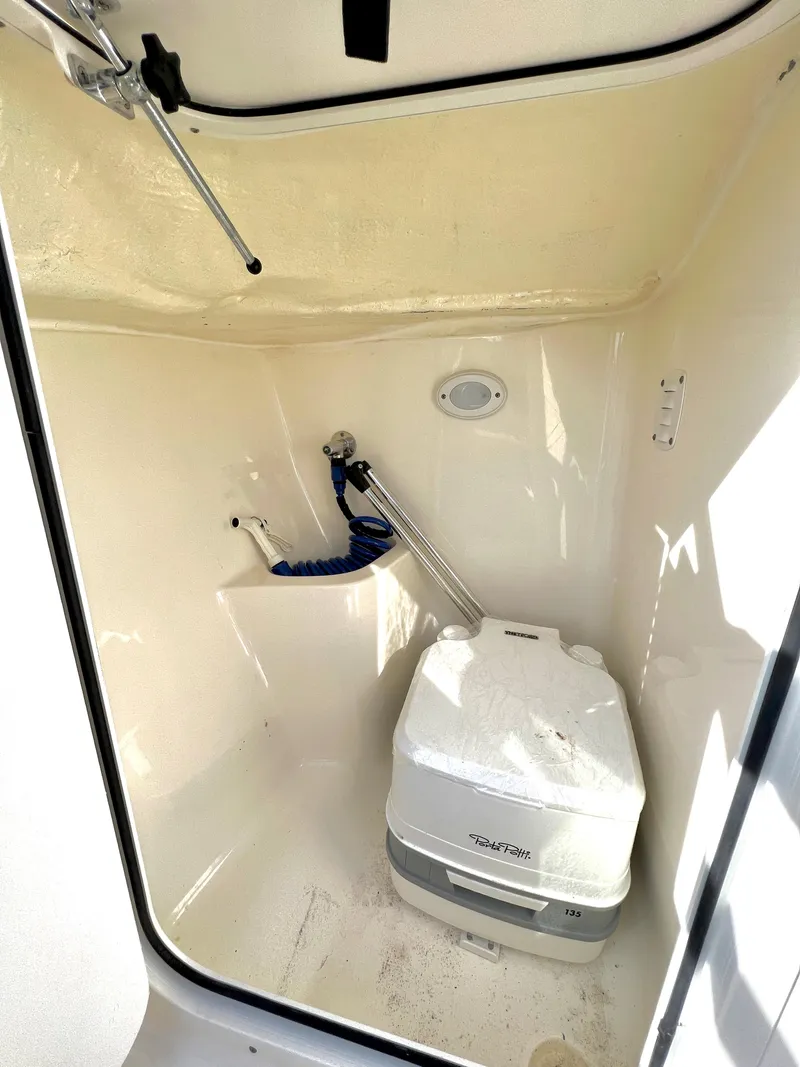 Slide: The Image of Interior of a 2021 Key West 203 DFS with portable toilet. - 18