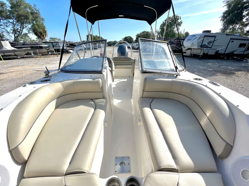 Slide: The Image of Interior view of a 2021 Key West 203 DFS boat with beige seating. - 27