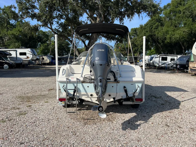 Slide: The Image of Rear view of a 2021 Key West 203 DFS boat on gravel lot. - 5