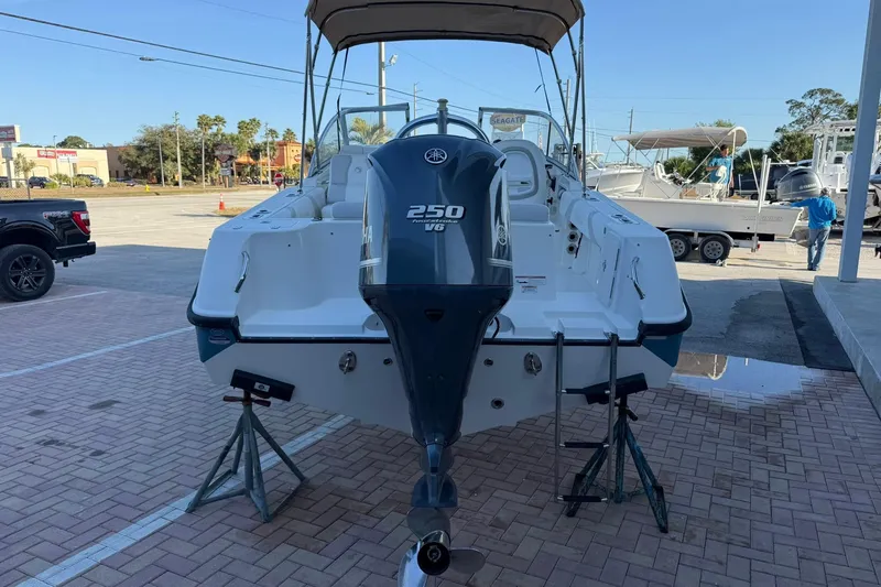 Slide: The Image of 2011 Edgewater 205CX Crossover boat with Yamaha 250 V6 engine on display. - 2