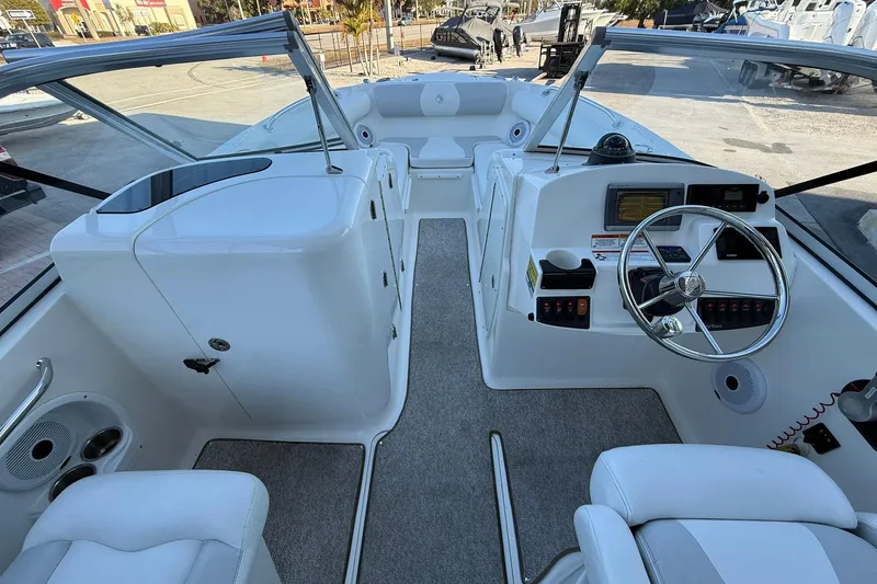 Slide: The Image of Interior view of 2011 Edgewater 205CX Crossover boat, featuring steering wheel and seating. - 20