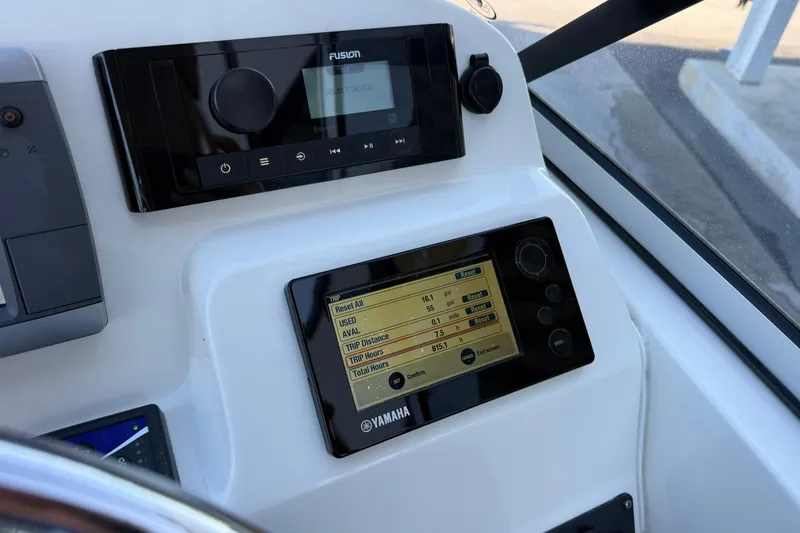 Slide: The Image of Dashboard of 2011 Edgewater 205CX Crossover with Yamaha display and Fusion audio system. - 23