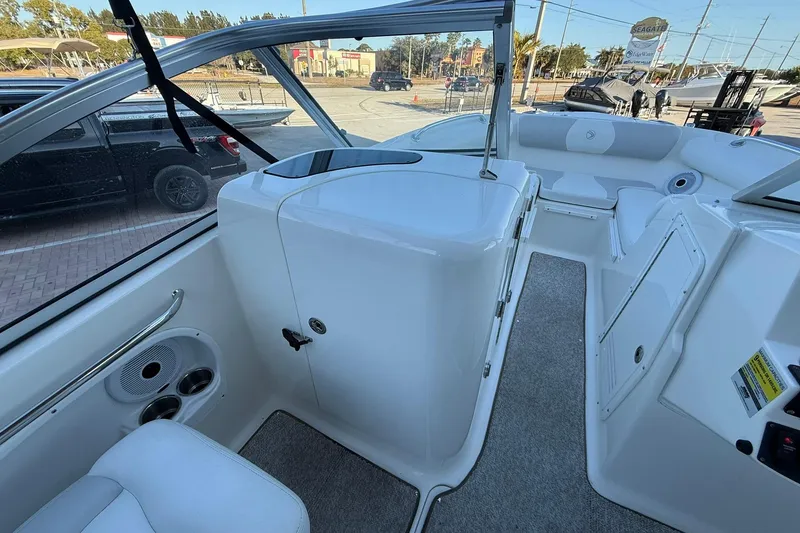 Slide: The Image of 2011 Edgewater 205CX Crossover boat interior with seating and storage compartments. - 29