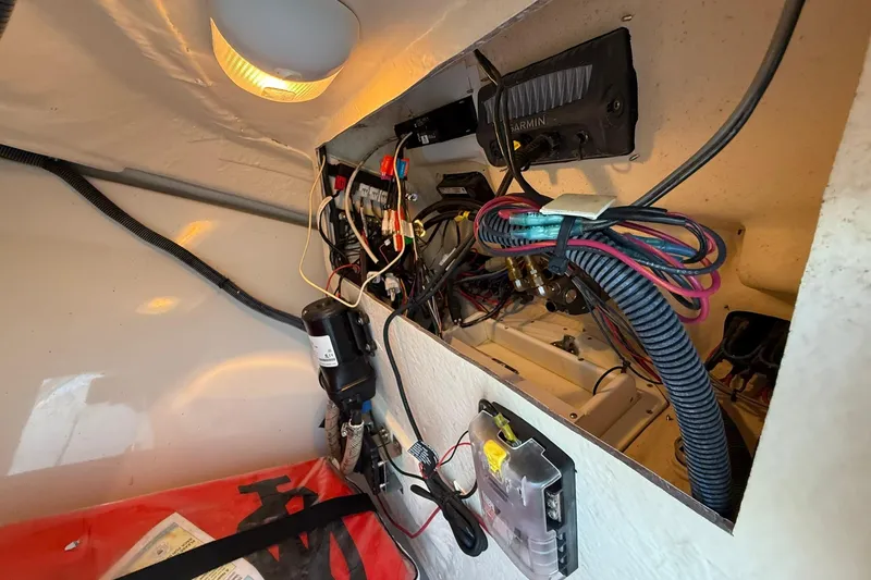 Slide: The Image of Electrical wiring and components inside a 2011 Edgewater 205CX Crossover boat. - 35