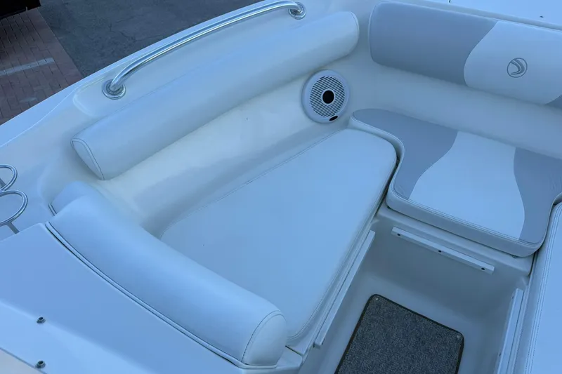 Slide: The Image of Interior seating of 2011 Edgewater 205CX Crossover boat, featuring white and gray upholstery. - 38