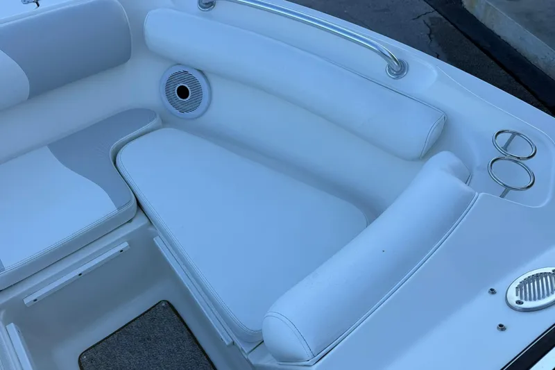 Slide: The Image of Interior seating of 2011 Edgewater 205CX Crossover boat with cup holders and speaker. - 39