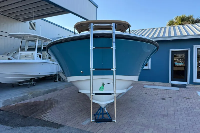 Slide: The Image of 2011 Edgewater 205CX Crossover boat displayed outdoors, front view. - 6