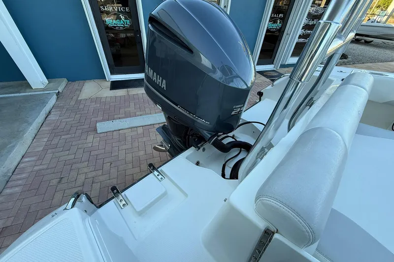 Slide: The Image of 2011 Edgewater 205CX Crossover boat with Yamaha outboard motor, docked near service center. - 7
