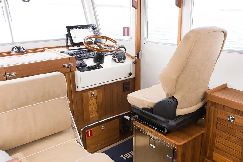 Slide: The Image of Interior of Targa 30.1 boat, 2027 model, featuring helm station. - 11