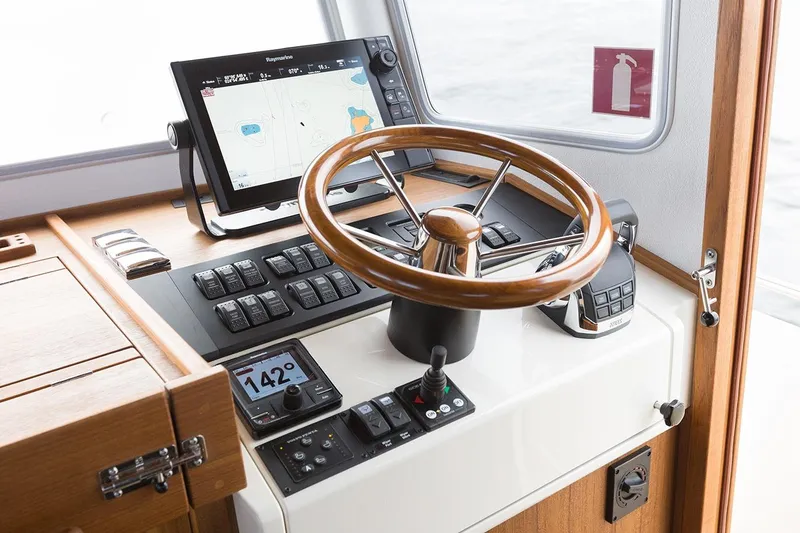Slide: The Image of Targa 30.1 yacht helm, 2027 model, featuring modern navigation technology. - 12