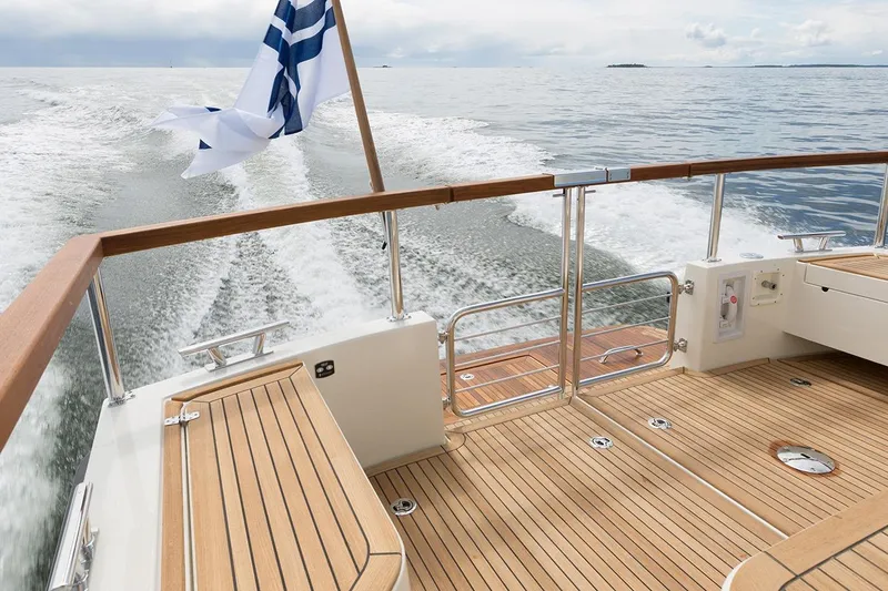 Slide: The Image of Targa 30.1 Yacht 2027 with wooden deck on open sea. - 9