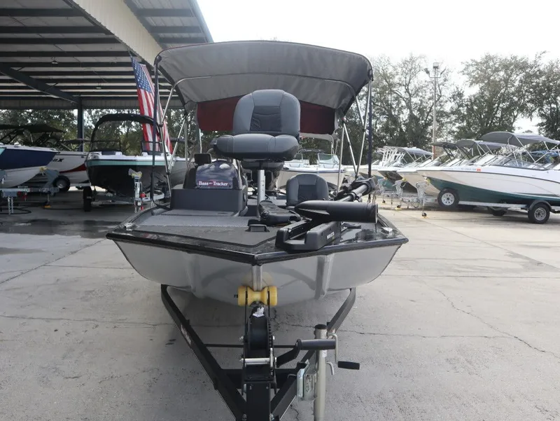 Slide: The Image of 2021 Tracker Bass Tracker Classic XL boat in a marina. - 3