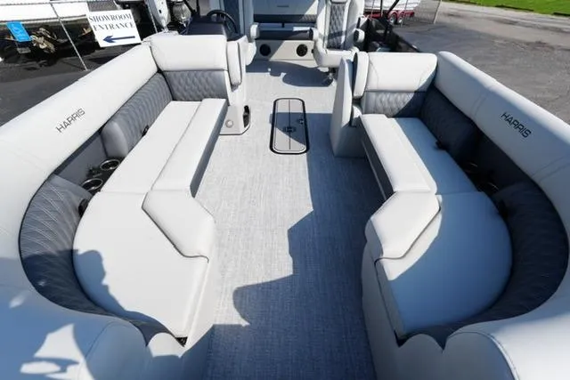 Slide: The Image of 2026 Harris Cruiser 230 SLDH pontoon boat interior with plush seating and modern design. - 12