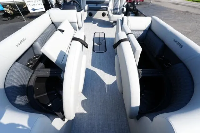 Slide: The Image of 2026 Harris Cruiser 230 SLDH pontoon boat interior with plush seating and modern design. - 13