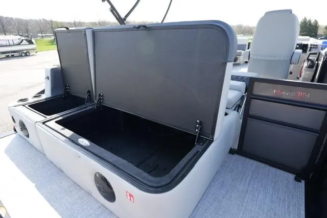 Slide: The Image of 2026 Harris Cruiser 230 SLDH pontoon boat with open storage compartments. - 21