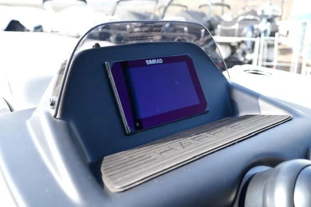 Slide: The Image of Simrad display on 2026 Harris Cruiser 230 SLDH dashboard, showcasing modern navigation technology. - 22