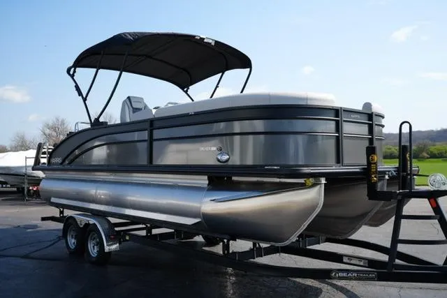 Slide: The Image of 2026 Harris Cruiser 230 SLDH pontoon boat on trailer, parked outdoors. - 7