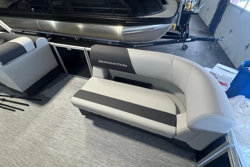 Slide: The Image of 2026 Bennington 20 S-One L-Bench boat interior with sleek seating design. - 8