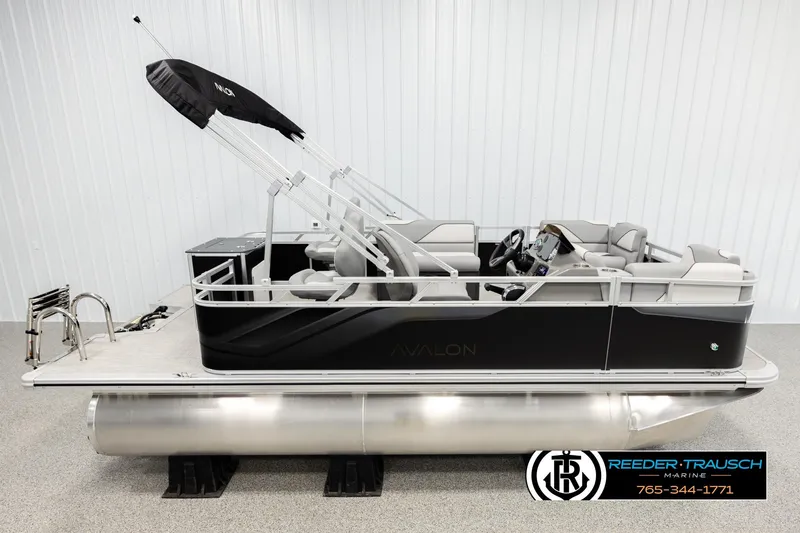 The Image of 2026 Avalon VEN RF pontoon boat with sleek black design and modern seating. - 1