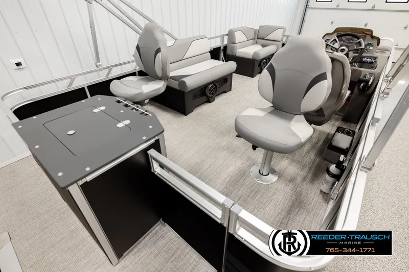 Slide: The Image of 2026 Avalon VEN RF boat interior with modern seating and control panel, Reeder-Trausch Marine logo. - 12