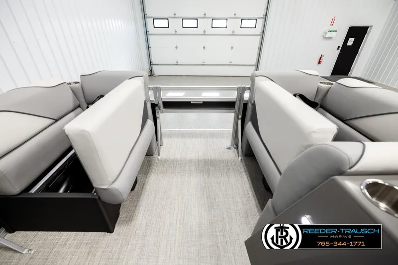 Slide: The Image of 2026 Avalon VEN RF interior with gray seating and storage compartments in a showroom. - 19