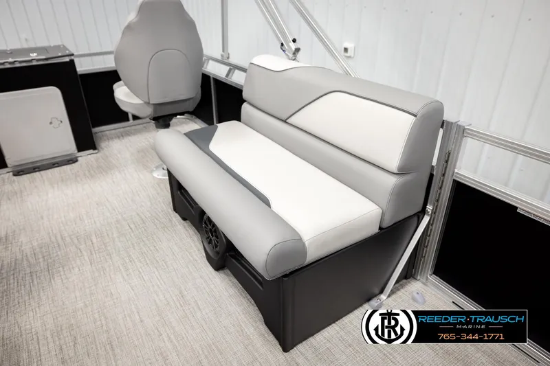 Slide: The Image of 2026 Avalon VEN RF boat interior with gray and white seating, Reeder-Trausch Marine branding. - 20