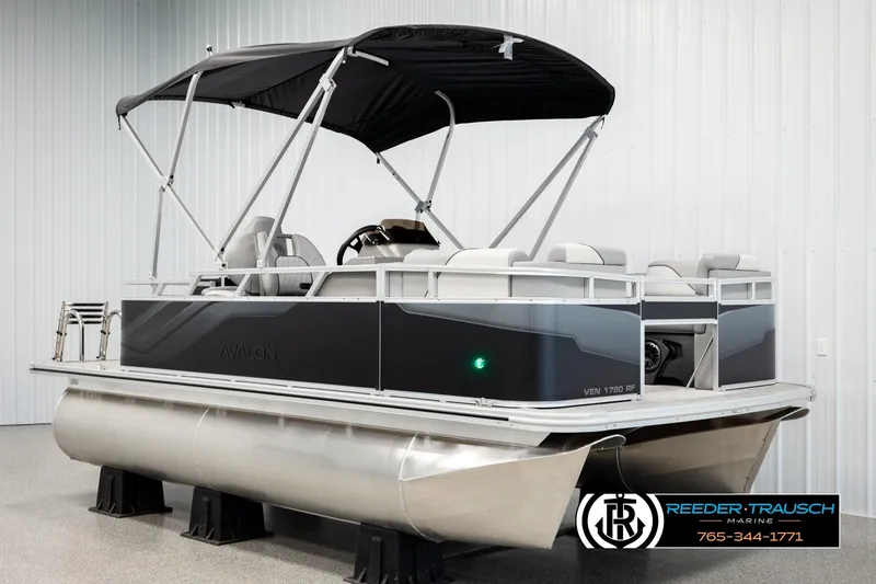Slide: The Image of 2026 Avalon VEN RF pontoon boat with canopy in showroom display. - 3