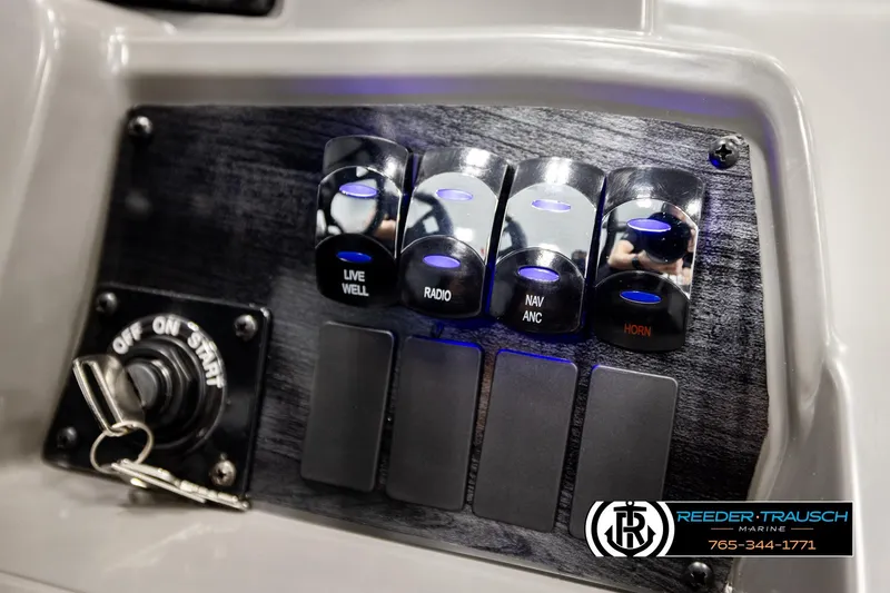 Slide: The Image of Control panel of 2026 Avalon VEN RF boat with labeled switches and ignition key. - 32