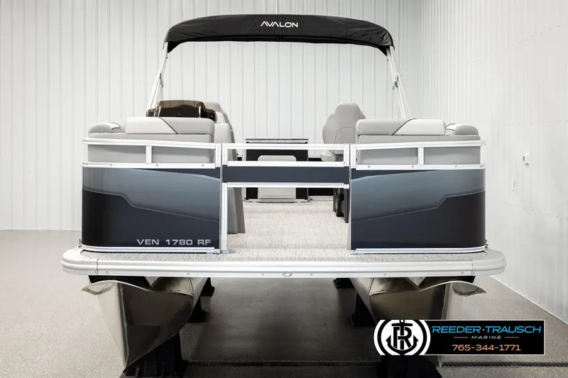 Slide: The Image of 2026 Avalon VEN RF pontoon boat in showroom, featuring sleek design and comfortable seating. - 7