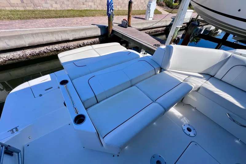 Slide: The Image of 2018 Cruisers Yachts 41 Cantius with white seating at dockside. - 16