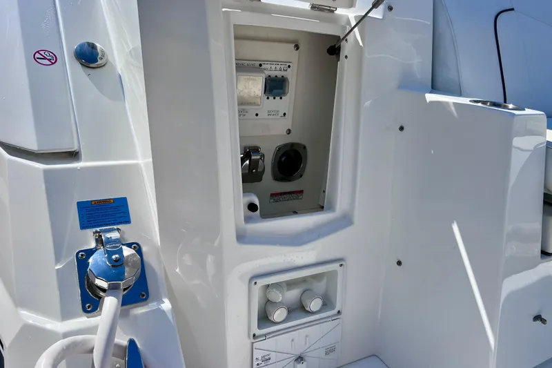 Slide: The Image of 2018 Cruisers Yachts 41 Cantius utility panel with controls and connections. - 19