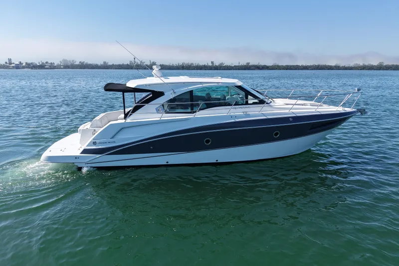 Slide: The Image of 2018 Cruisers Yachts 41 Cantius on calm water, side view. - 3
