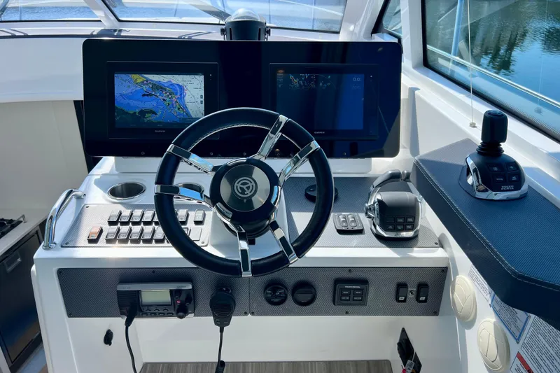 Slide: The Image of 2018 Cruisers Yachts 41 Cantius helm with navigation screens and controls. - 36