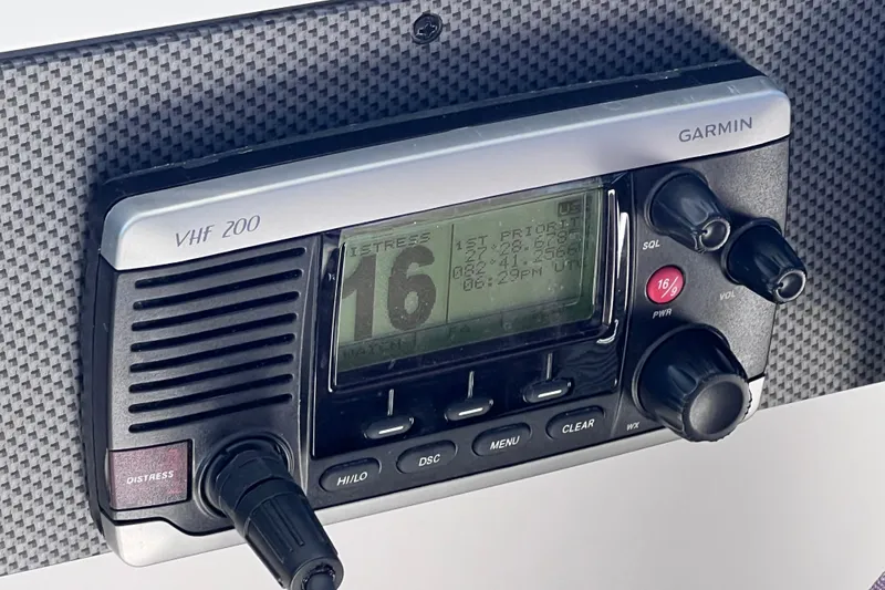 Slide: The Image of Garmin VHF 200 radio on 2018 Cruisers Yachts 41 Cantius dashboard. - 44