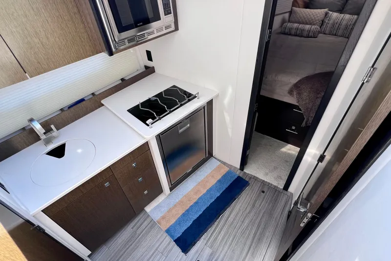 Slide: The Image of Modern kitchen area in 2018 Cruisers Yachts 41 Cantius with sleek appliances. - 48