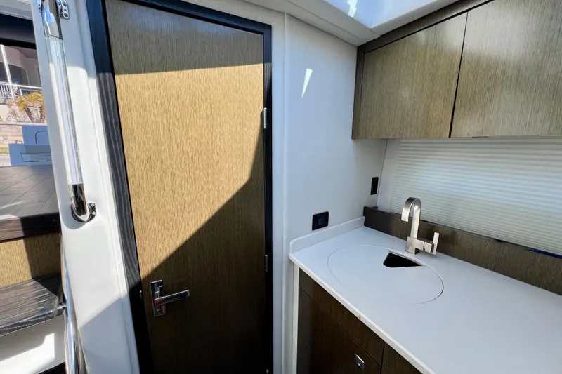 Slide: The Image of 2018 Cruisers Yachts 41 Cantius interior with modern kitchenette and sleek cabinetry. - 51