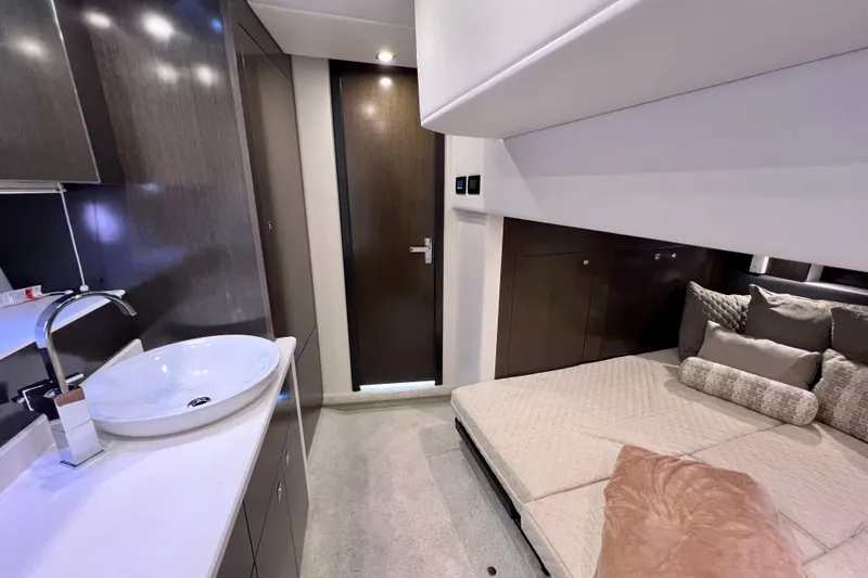 Slide: The Image of Luxurious interior of 2018 Cruisers Yachts 41 Cantius with modern sink and cozy bedding. - 58