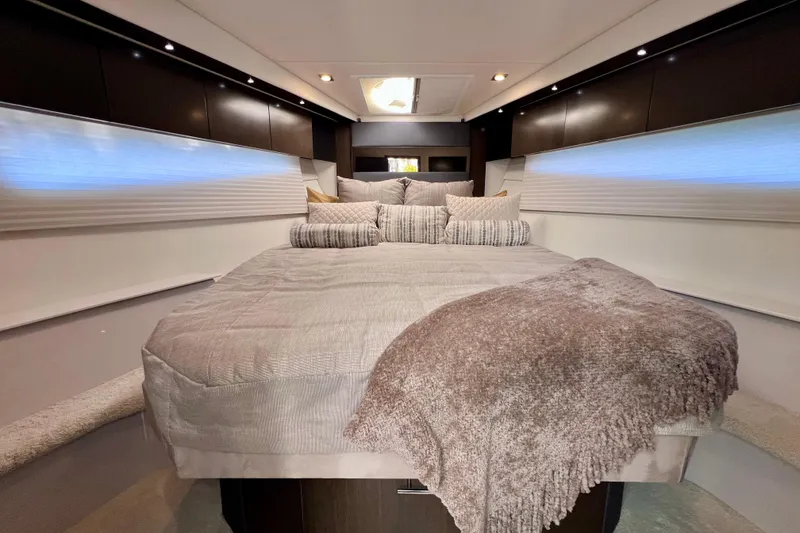 Slide: The Image of Luxurious bedroom interior of 2018 Cruisers Yachts 41 Cantius with plush bedding. - 61