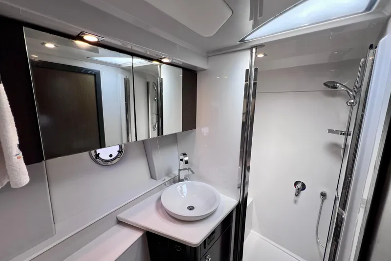 Slide: The Image of Luxurious bathroom in 2018 Cruisers Yachts 41 Cantius with modern fixtures and shower. - 68
