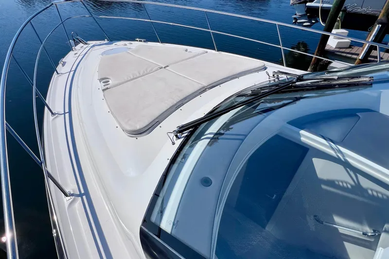 Slide: The Image of 2018 Cruisers Yachts 41 Cantius boat deck with sunpad, docked on calm water. - 77