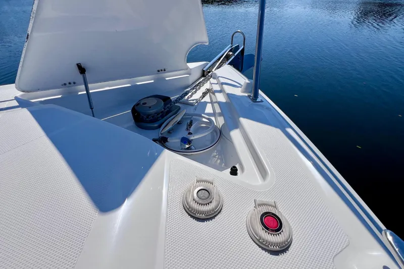 Slide: The Image of 2018 Cruisers Yachts 41 Cantius bow with anchor and winch system on calm water. - 79