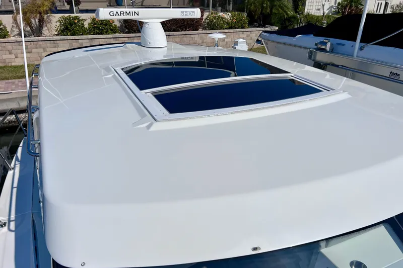 Slide: The Image of 2018 Cruisers Yachts 41 Cantius with Garmin radar and sunroof on deck. - 81