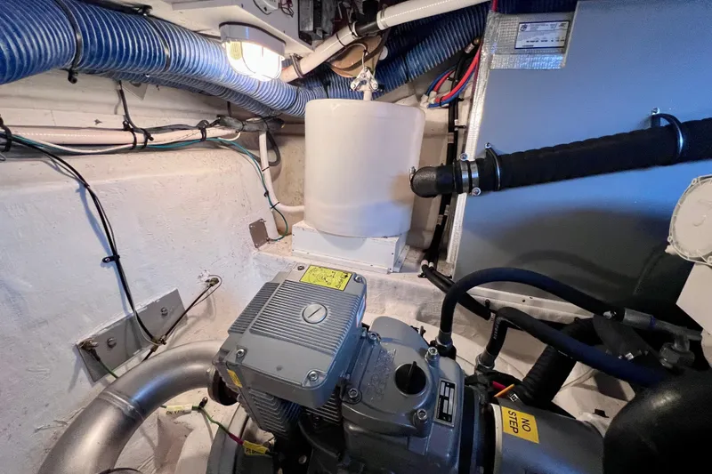 Slide: The Image of Engine room of 2018 Cruisers Yachts 41 Cantius with visible machinery and wiring. - 87