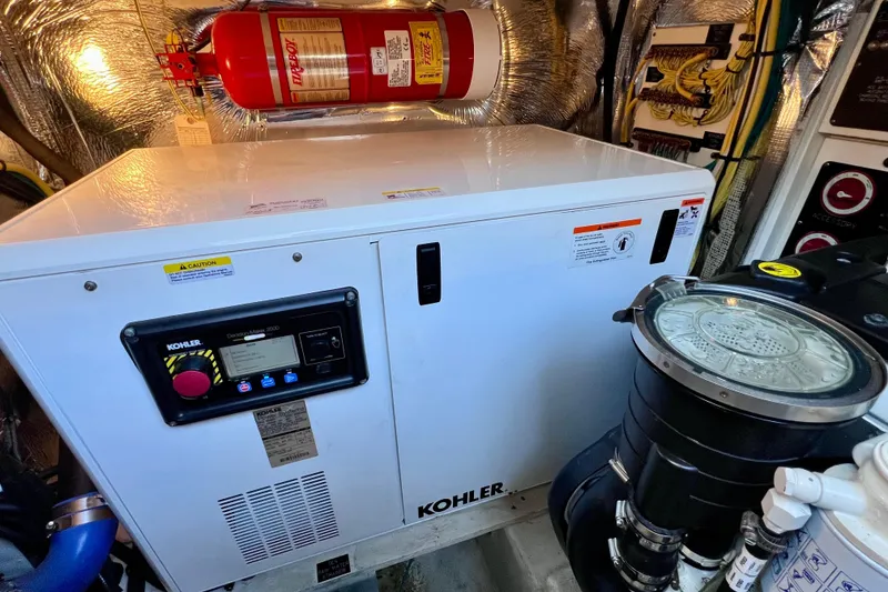 Slide: The Image of Engine room of 2018 Cruisers Yachts 41 Cantius with Kohler generator and fire extinguisher. - 89