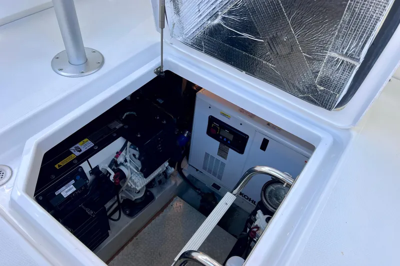 Slide: The Image of Engine compartment of 2018 Cruisers Yachts 41 Cantius, showcasing generator and equipment. - 94