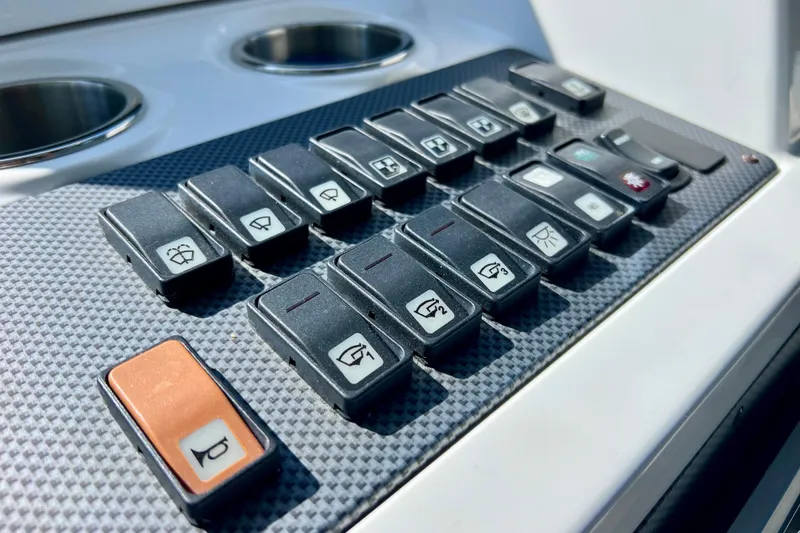 Slide: The Image of Control panel of 2018 Cruisers Yachts 41 Cantius with labeled switches. - 39