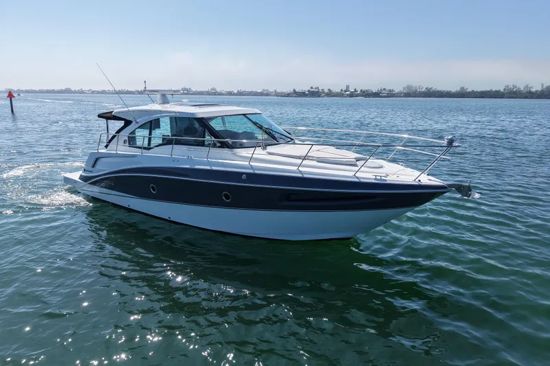 Slide: The Image of 2018 Cruisers Yachts 41 Cantius on calm water, side view. - 4