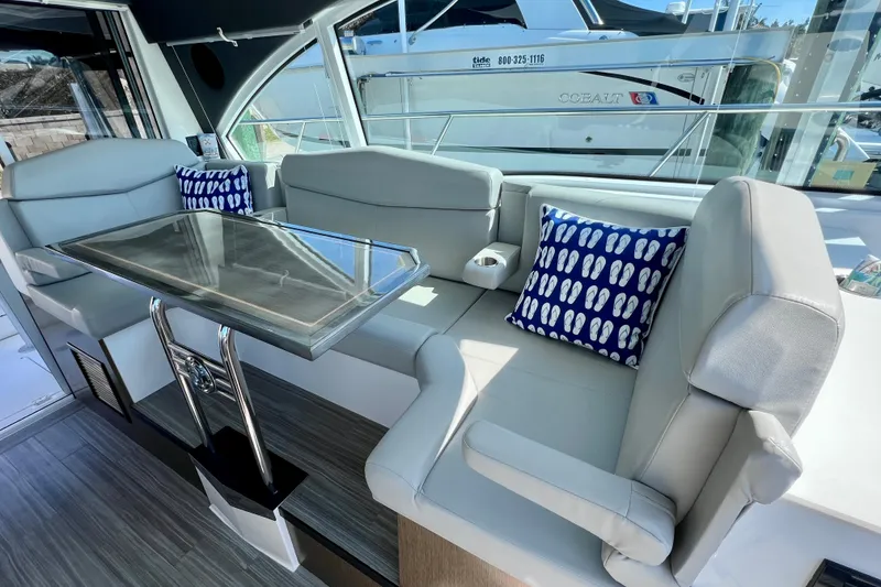 Slide: The Image of 2018 Cruisers Yachts 41 Cantius interior with sleek seating and modern table design. - 45